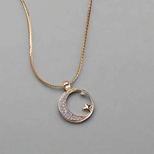 Close-up of celestial moon necklace with stone details