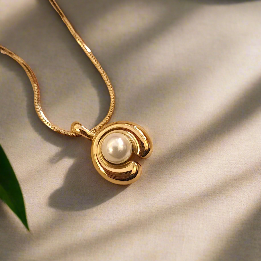 Golden crescent moon necklace with elegant pearl jewellery