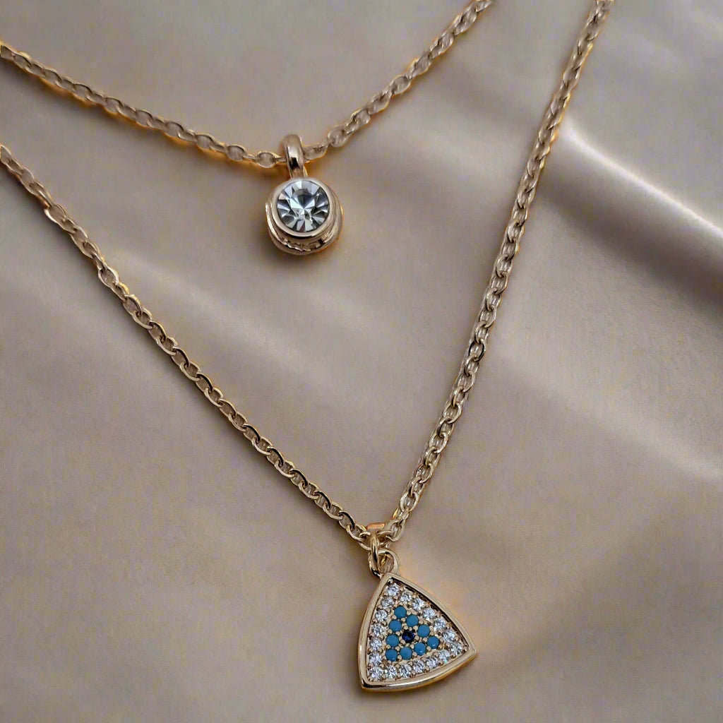 Dual layer evil eye necklace with crystal radiant golden tone