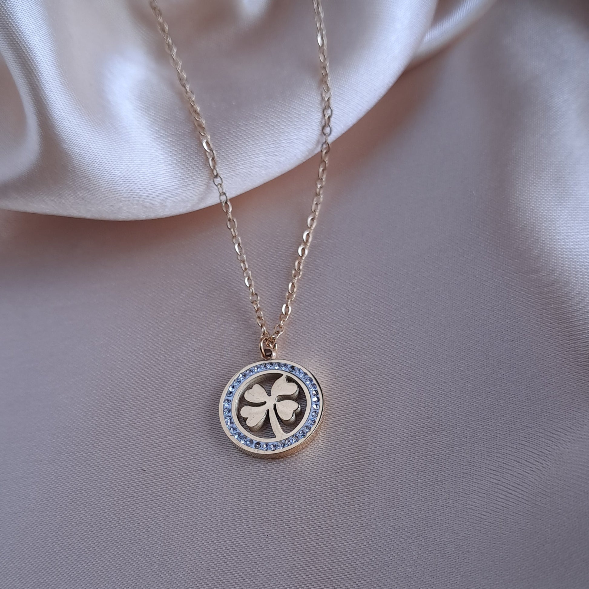 Golden lucky charm clover necklace with sparkling stones