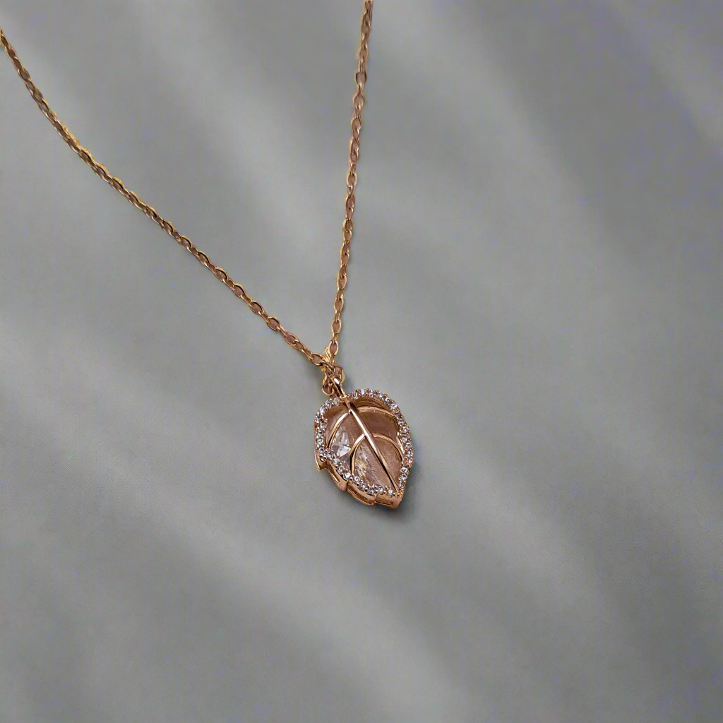 Golden stone-studded leaf design crystal necklace