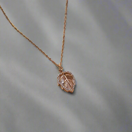 Golden stone-studded leaf design crystal necklace