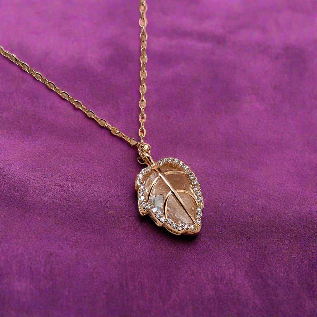 Unique crystal pendant in golden leaf setting