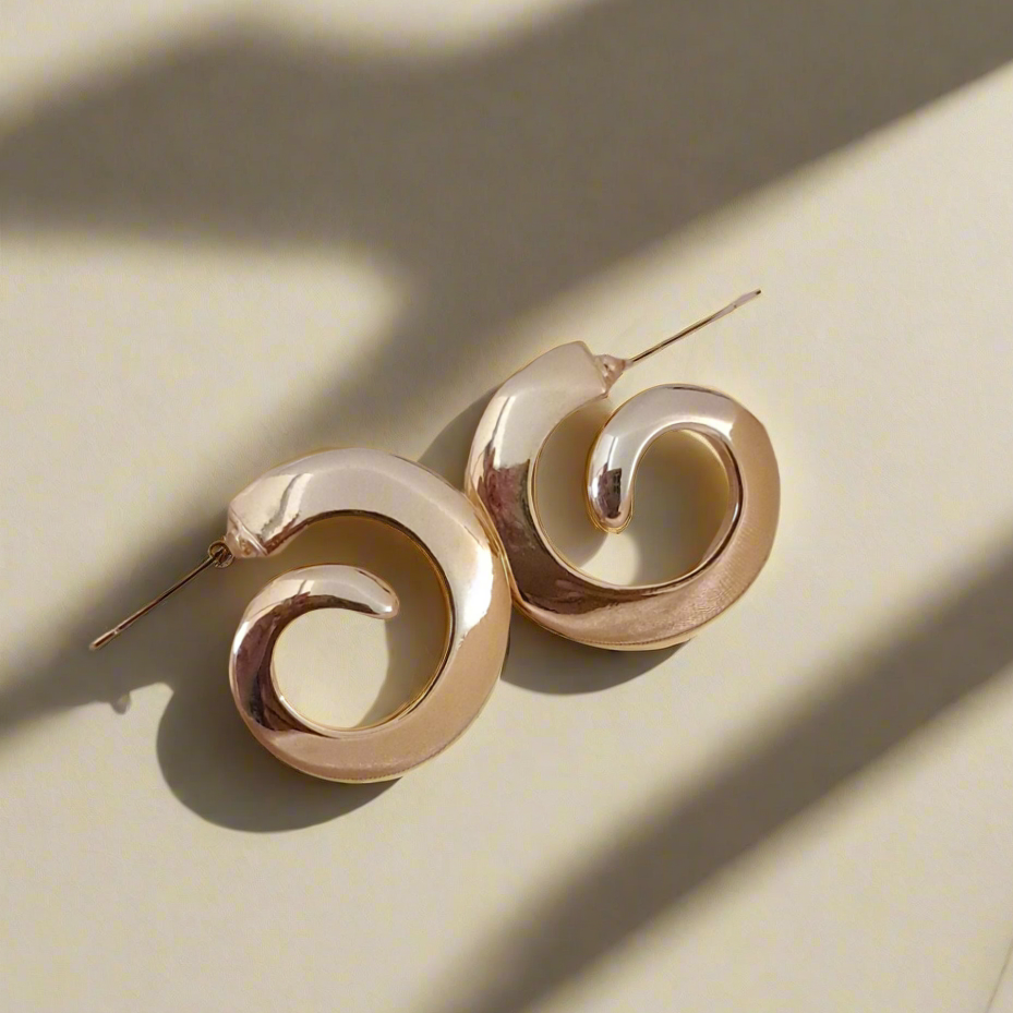 Anti-tarnish spiral earrings close-up golden finish