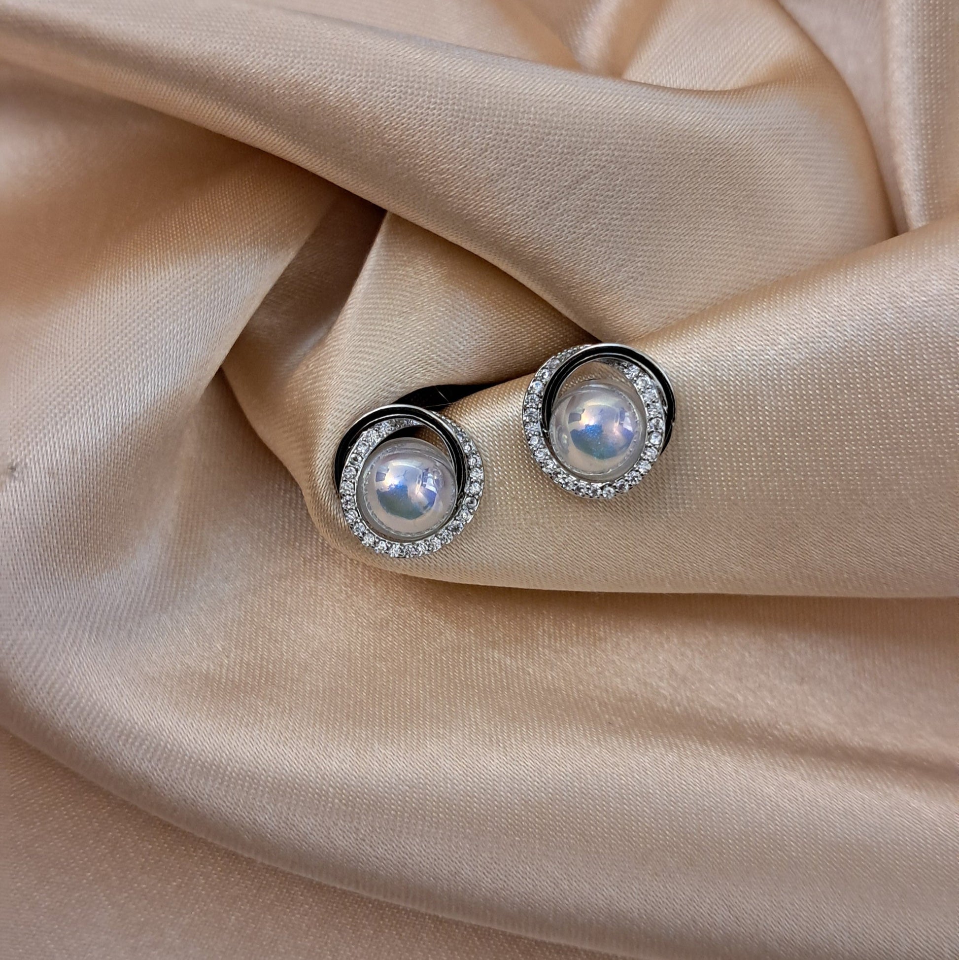 Pearl earrings with stone-studded silver-tone finish elegant