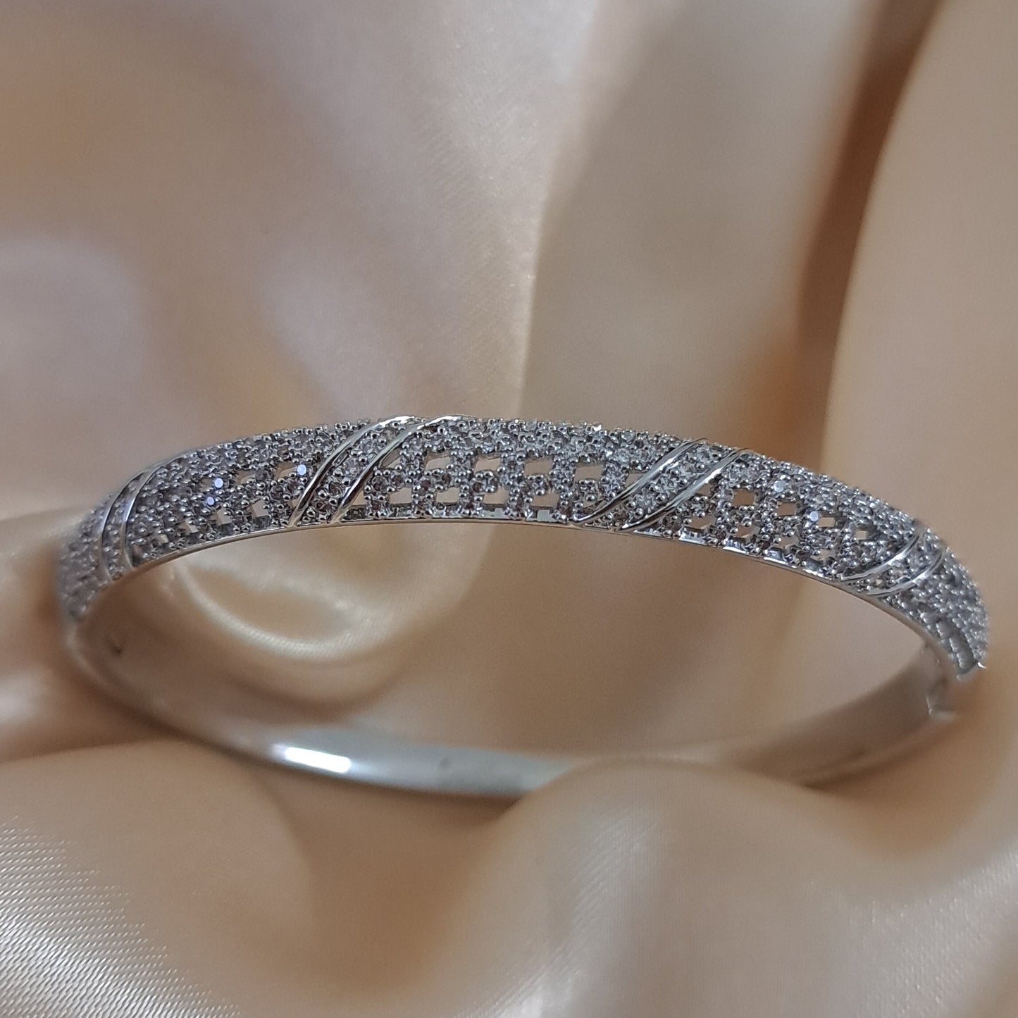 Silver shade bracelet with intricate American diamond detailing